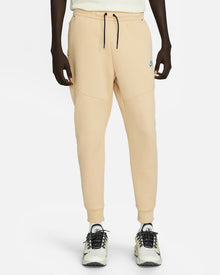 Calça jogger Nike Tech Fleece - Bege e Azul